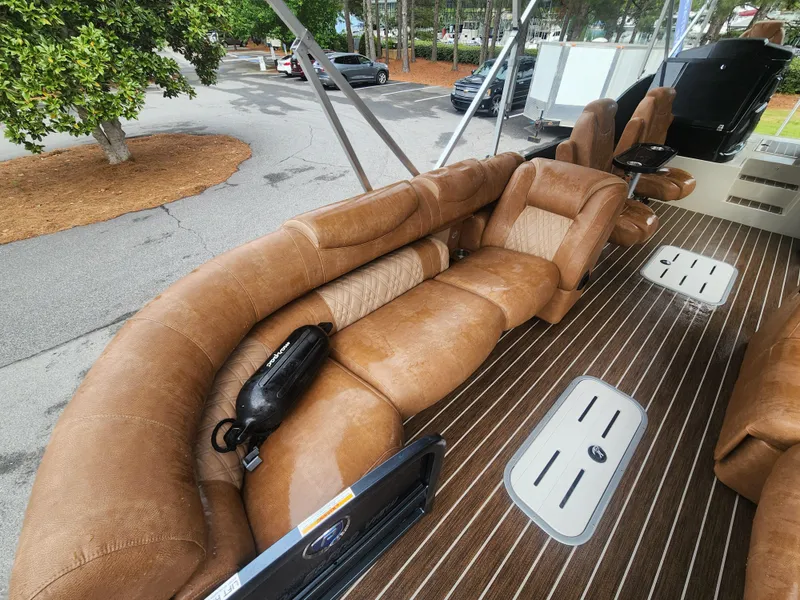 Slide: The Image of Luxurious seating on 2021 Premier 290 Grand View boat with brown upholstery and striped flooring. - 16