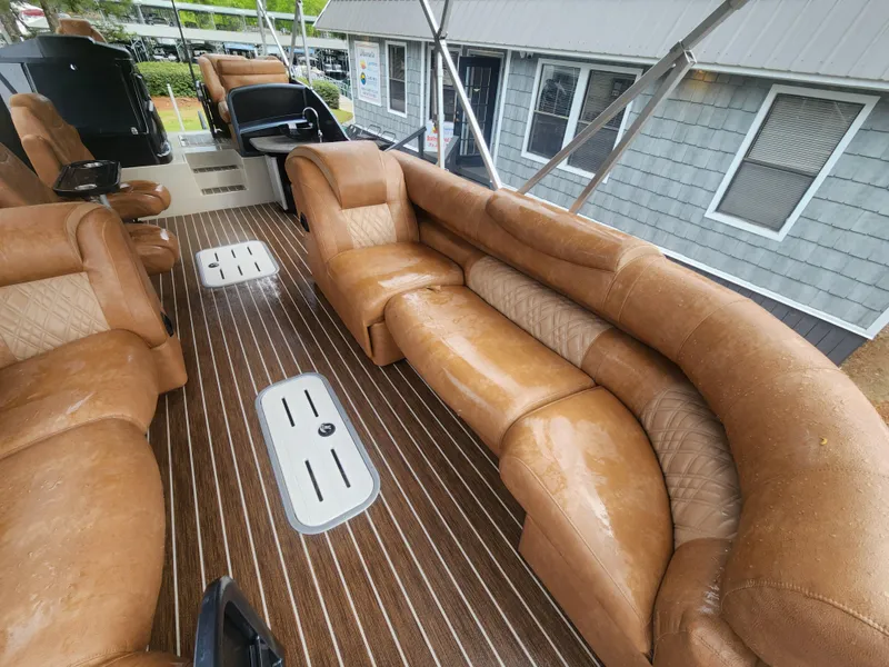 Slide: The Image of Luxurious seating on 2021 Premier 290 Grand View boat with brown leather and wood flooring. - 17