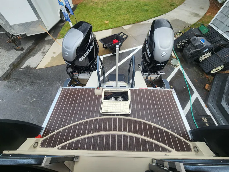 Slide: The Image of 2021 Premier 290 Grand View boat with dual Suzuki outboard motors, viewed from above. - 9