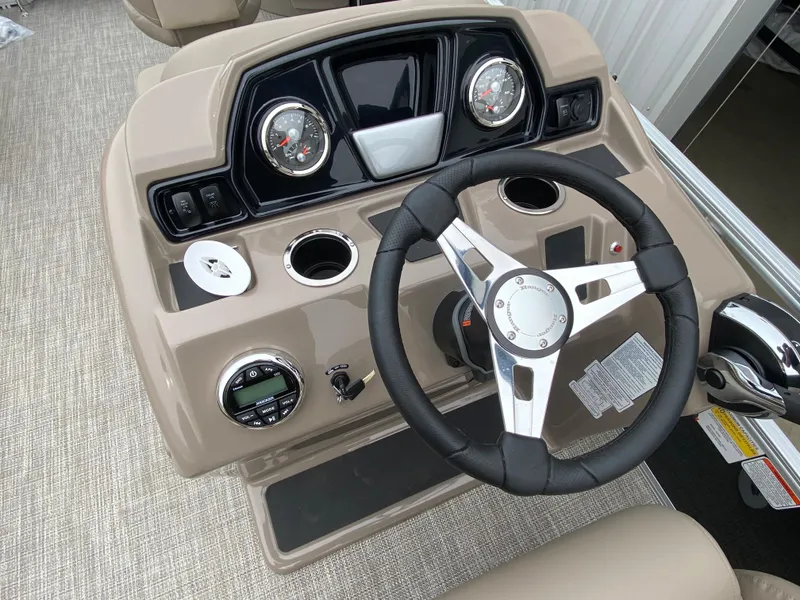 Slide: The Image of 2023 Ranger 200F boat dashboard with steering wheel, gauges, and controls. - 4