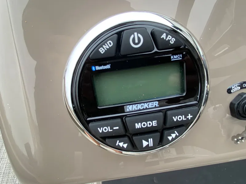 Slide: The Image of Control panel of a 2023 Ranger 200F with Kicker audio system and Bluetooth connectivity. - 5