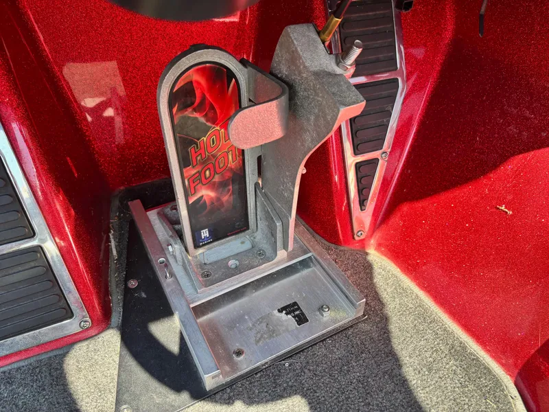 Slide: The Image of Red interior of a 2010 Ranger Z520 boat featuring a "Hot Foot" throttle pedal. - 12