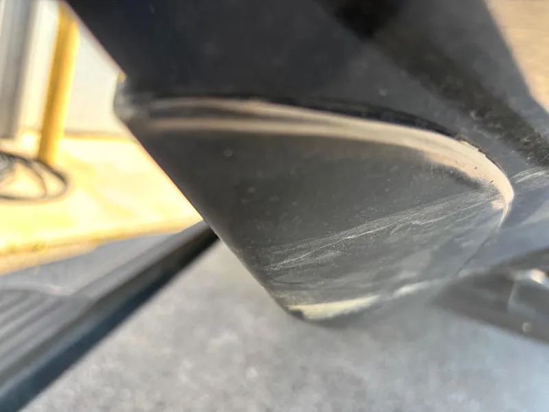 Slide: The Image of Close-up of a 2010 Ranger Z520 boat hull with visible wear marks. - 2