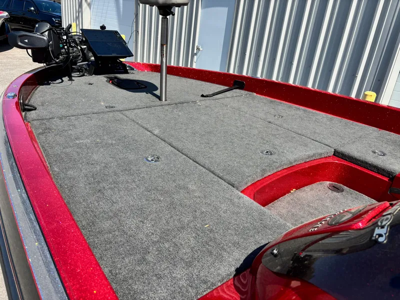 Slide: The Image of 2010 Ranger Z520 boat deck with red trim and mounted electronics. - 5