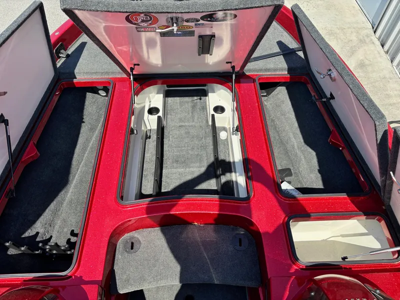 Slide: The Image of Open storage compartments on a 2010 Ranger Z520 boat, showcasing interior layout and design. - 7