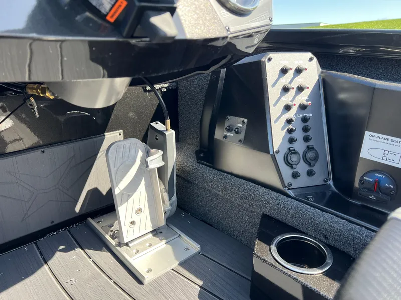 Slide: The Image of 2025 Vexus AVX1985S boat interior, featuring control panel and foot pedal. - 10