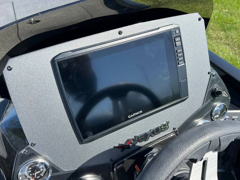 Slide: The Image of 2025 Vexus AVX1985S dashboard featuring a Garmin display and steering wheel. - 11