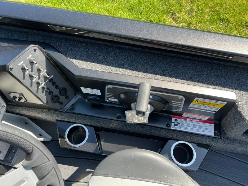 Slide: The Image of Control panel of 2025 Vexus AVX1985S boat with switches and cup holders. - 12