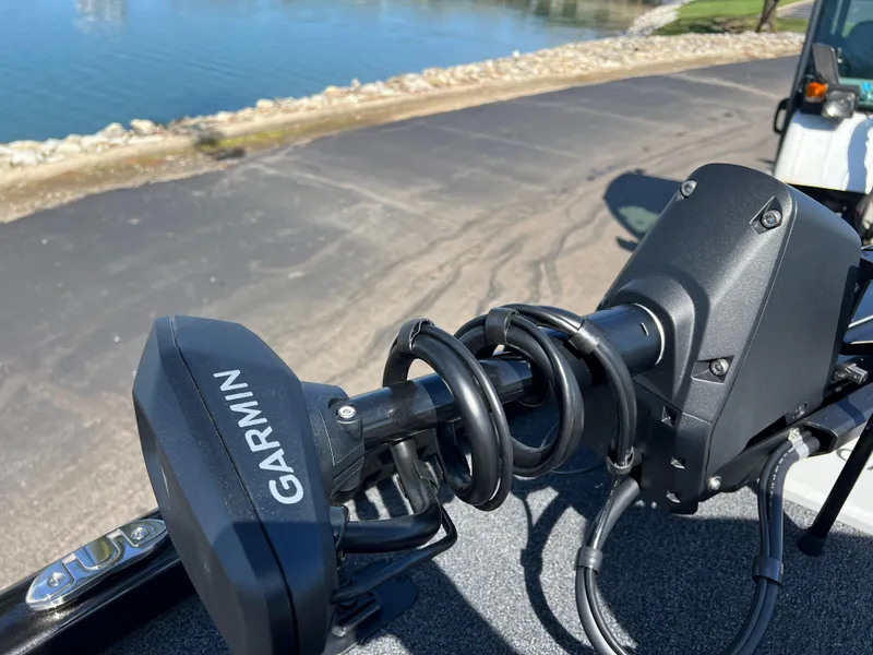 Slide: The Image of Garmin device on 2025 Vexus AVX1985S boat near a lakeside road. - 17