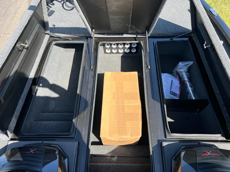 Slide: The Image of 2025 Vexus AVX1985S boat storage compartments with cardboard box and accessories. - 20