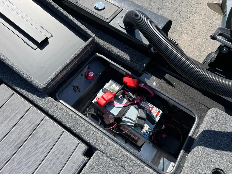 Slide: The Image of 2025 Vexus AVX1985S boat battery compartment with wiring and components. - 25