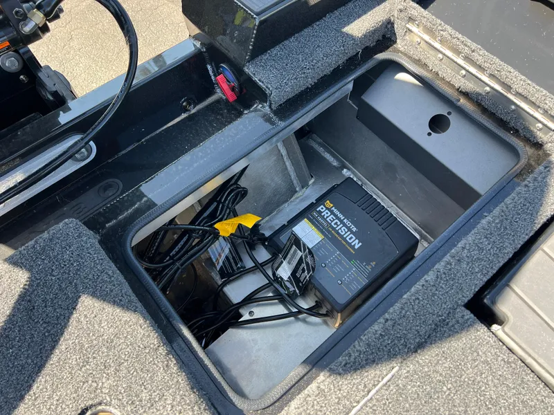 Slide: The Image of 2025 Vexus AVX1985S boat compartment with battery charger and wiring. - 26