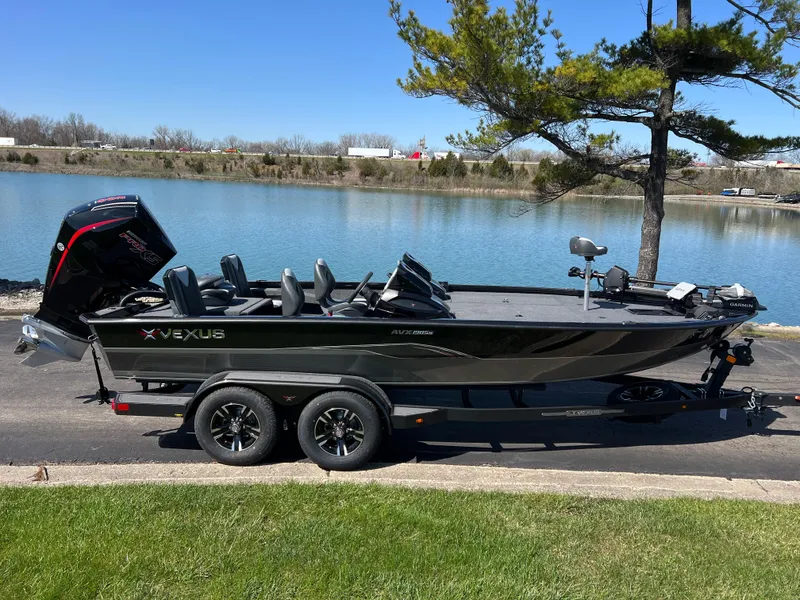 Slide: The Image of 2025 Vexus AVX1985S boat on trailer by a lake, under a clear blue sky. - 3