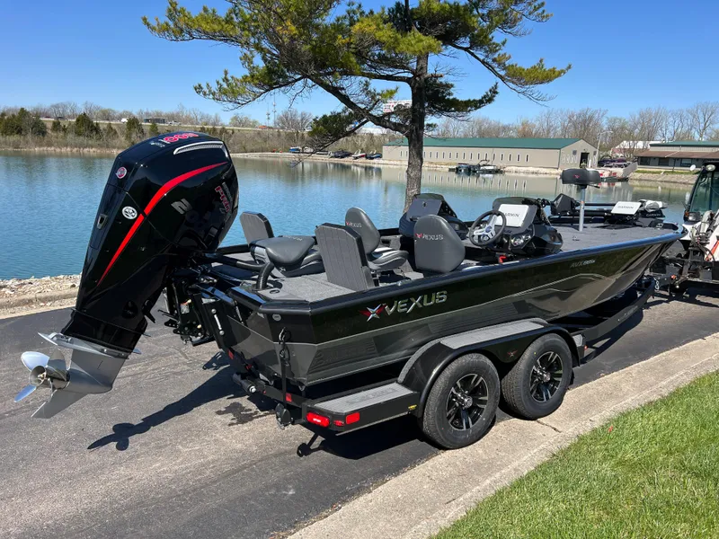 Slide: The Image of 2025 Vexus AVX1985S boat on trailer by a lake, featuring a powerful outboard motor. - 4