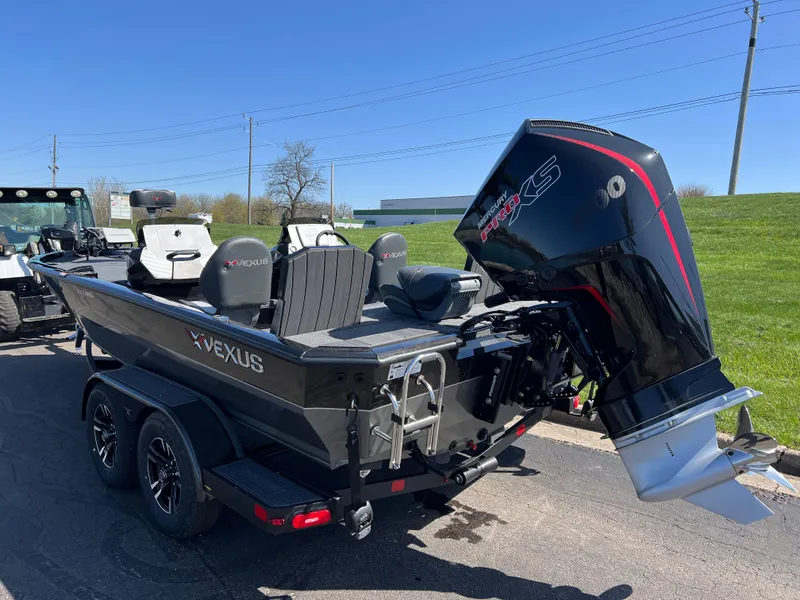 Slide: The Image of 2025 Vexus AVX1985S boat with powerful outboard motor on a trailer. - 6