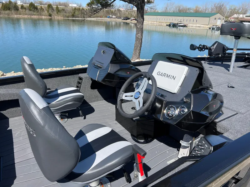 Slide: The Image of 2025 Vexus AVX1985S boat interior with Garmin navigation system, featuring dual seats and steering wheel. - 8