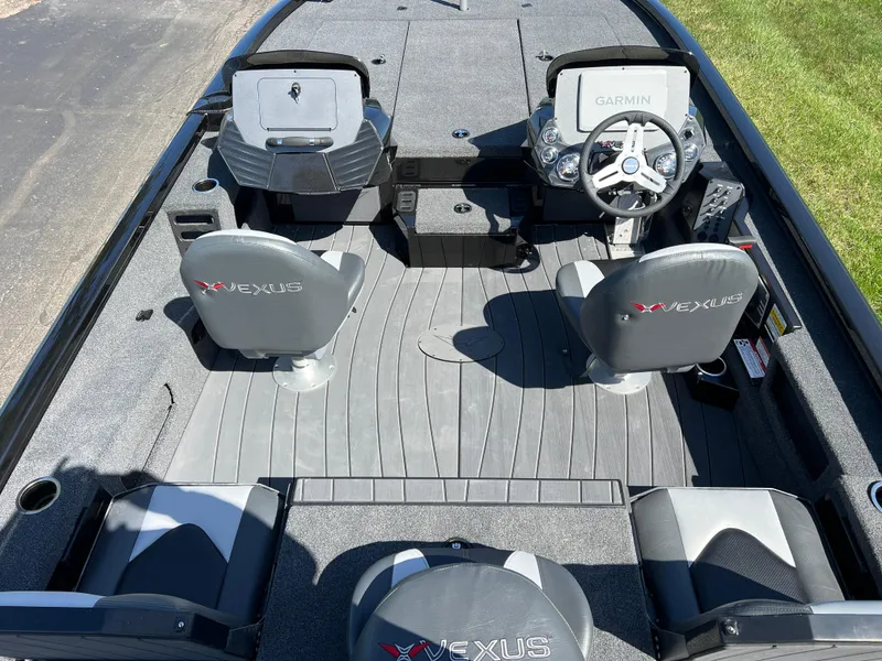 Slide: The Image of 2025 Vexus AVX1985S boat interior with Garmin system, dual seats, and sleek design. - 9