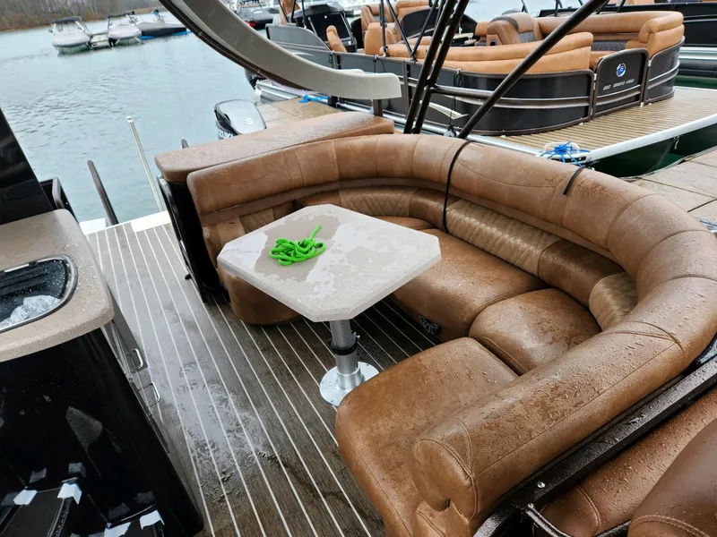 Slide: The Image of Luxurious 2023 Premier Escalante boat with plush seating and table on deck. - 6