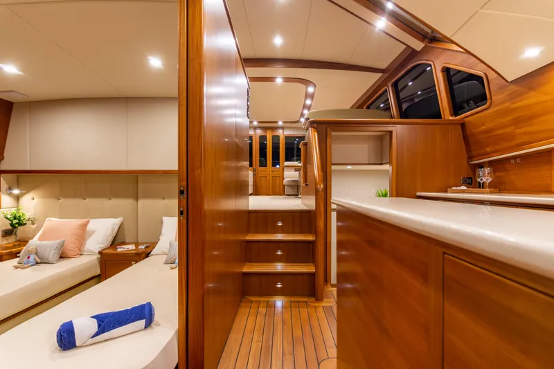 Slide: The Image of Luxurious interior of 2021 Palm Beach Motor Yachts PB65 with elegant wood finishes and cozy seating. - 20