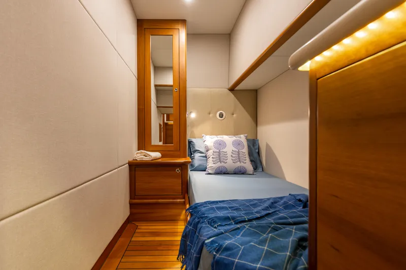 Slide: The Image of Luxurious cabin interior of 2021 Palm Beach Motor Yachts PB65 with elegant wood finishes. - 27