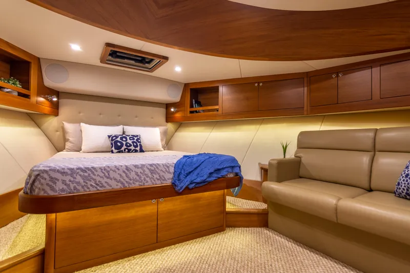 Slide: The Image of Luxurious cabin interior of 2021 Palm Beach Motor Yachts PB65, featuring elegant wood finishes. - 4