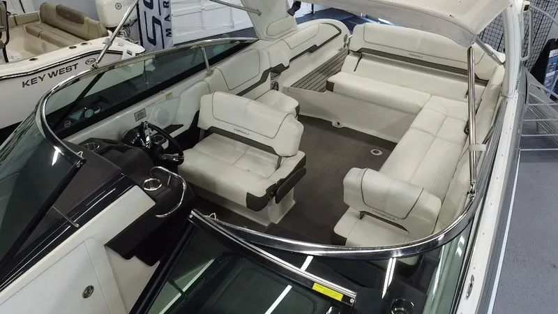 Slide: The Image of 2018 Formula 290 Bowrider boat interior with spacious seating in showroom. - 11