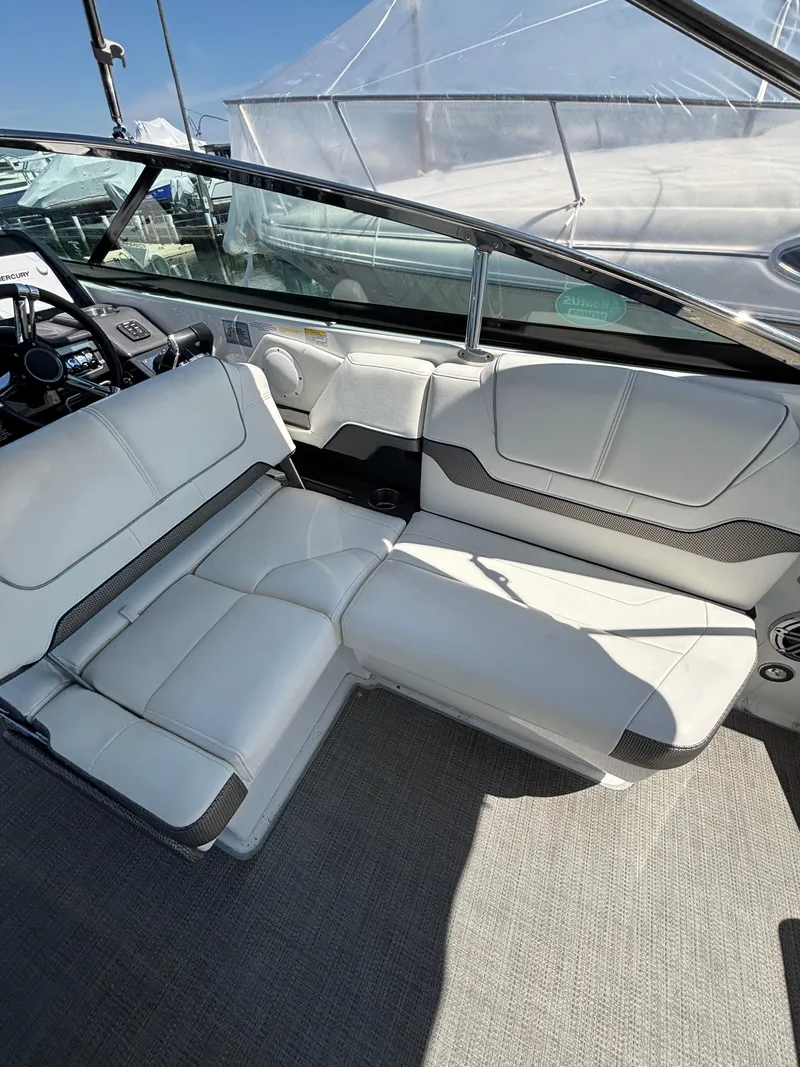Slide: The Image of 2018 Formula 290 Bowrider interior with white seating and modern dashboard. - 17