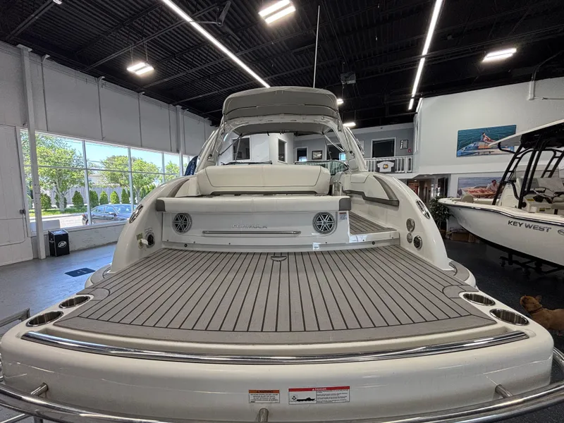 Slide: The Image of 2018 Formula 290 Bowrider cockpit with steering wheel, gauges, and Garmin navigation system. - 23