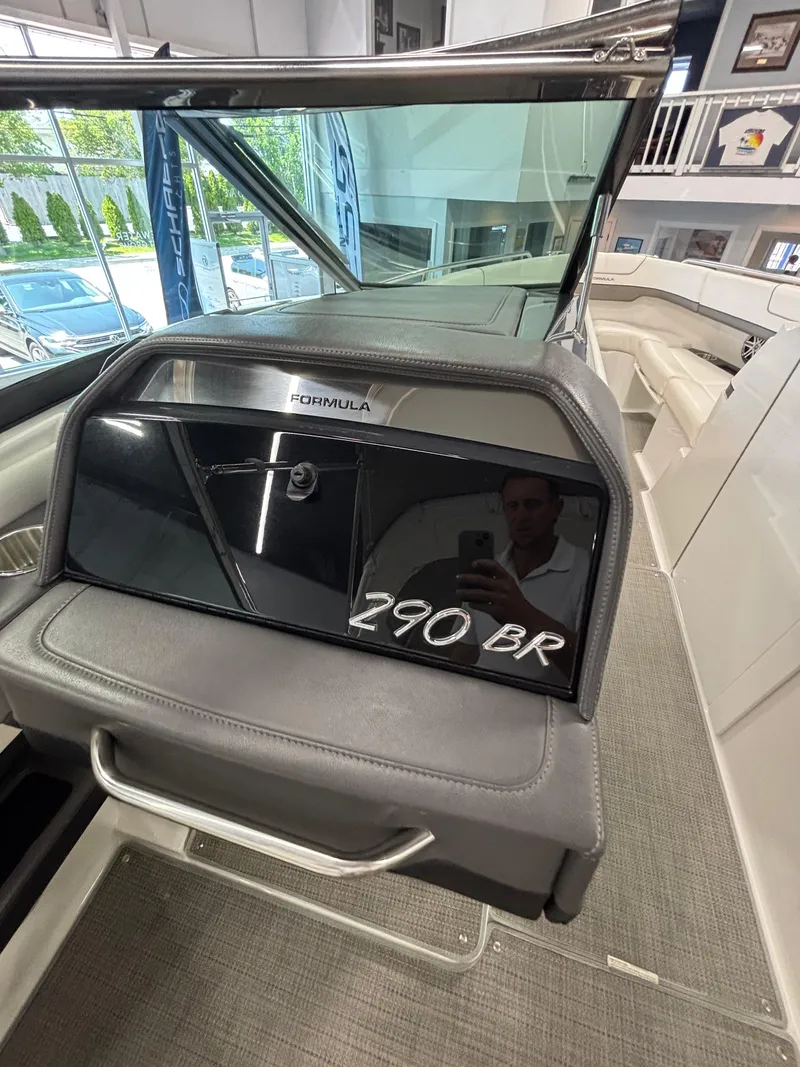 Slide: The Image of Control panel of a 2018 Formula 290 Bowrider boat with switches and communication equipment. - 28