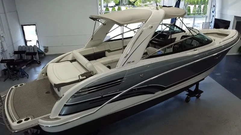 Slide: The Image of 2018 Formula 290 Bowrider in showroom, featuring spacious seating and sleek design. - 3