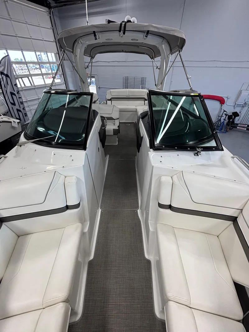 Slide: The Image of 2018 Formula 290 Bowrider interior with white seating and modern helm. - 33