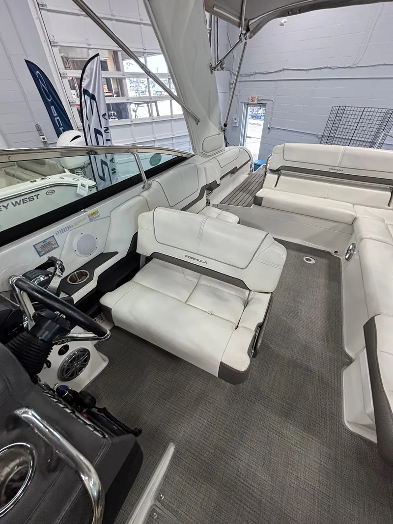 Slide: The Image of 2018 Formula 290 Bowrider interior with white seating and modern design. - 34