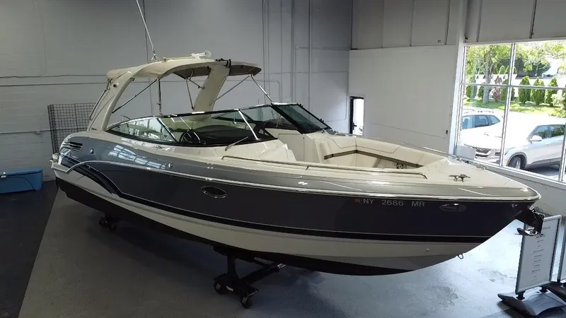 Slide: The Image of 2018 Formula 290 Bowrider boat on display, sleek design, gray and white exterior. - 4