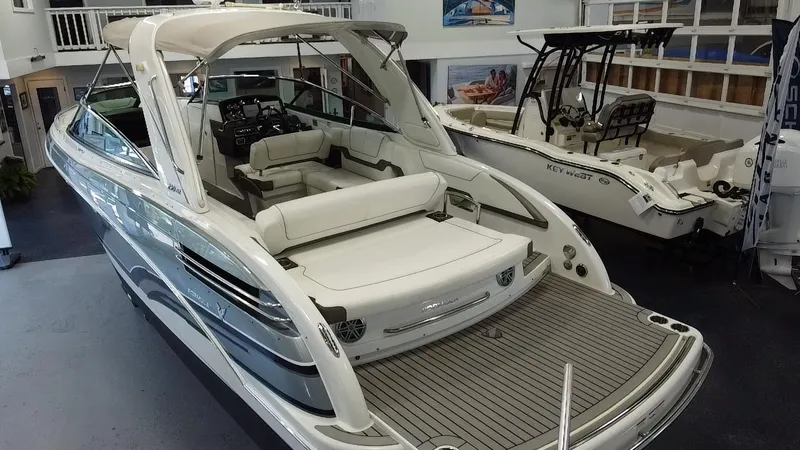 Slide: The Image of 2018 Formula 290 Bowrider boat displayed indoors, featuring sleek design and modern amenities. - 6