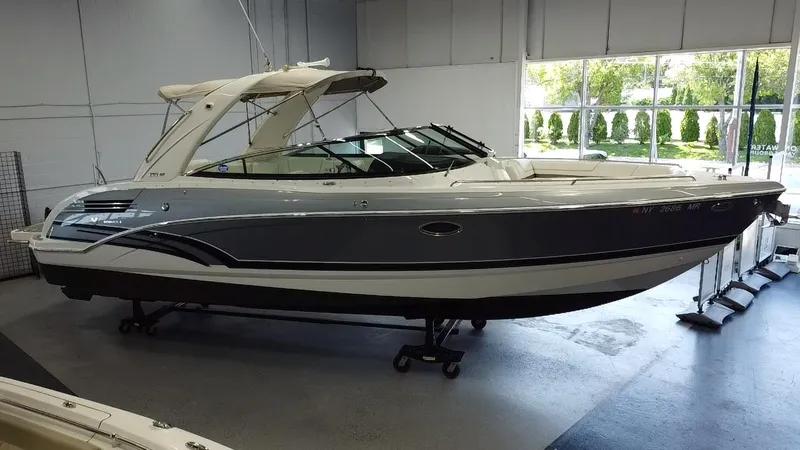 Slide: The Image of 2018 Formula 290 Bowrider boat displayed indoors, showcasing sleek design and spacious seating. - 7