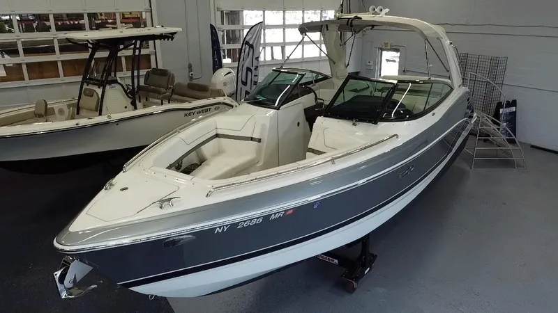 Slide: The Image of 2018 Formula 290 Bowrider with spacious white seating and sleek design. - 9