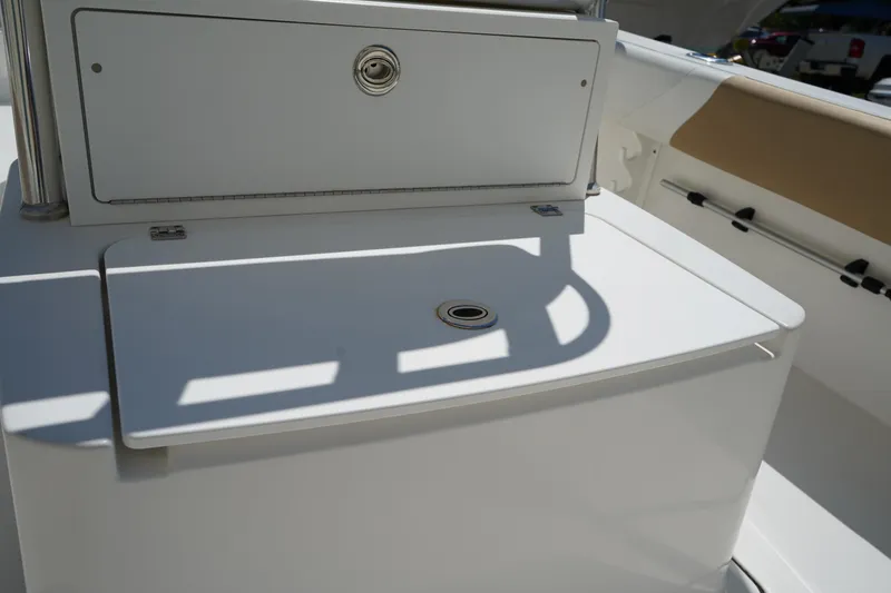 Slide: The Image of 2021 Edgewater 188CC boat interior with storage compartments and seating area. - 16