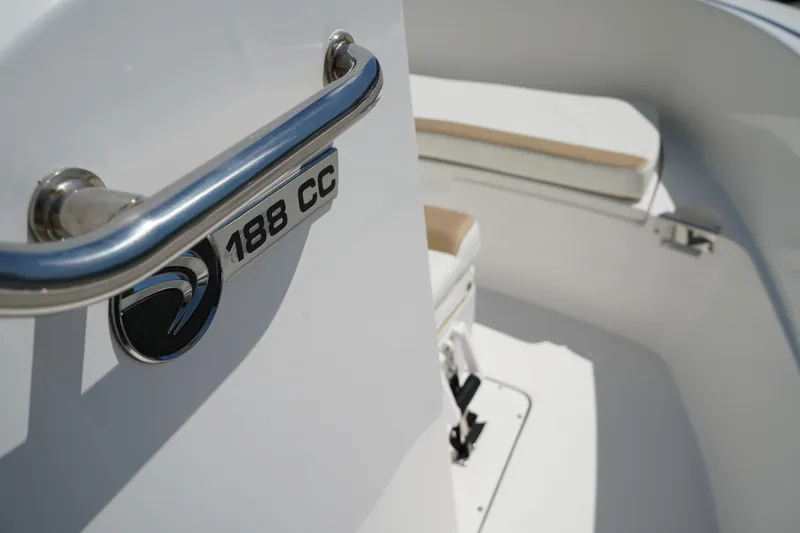 Slide: The Image of 2021 Edgewater 188CC boat interior with seating and model emblem. - 32