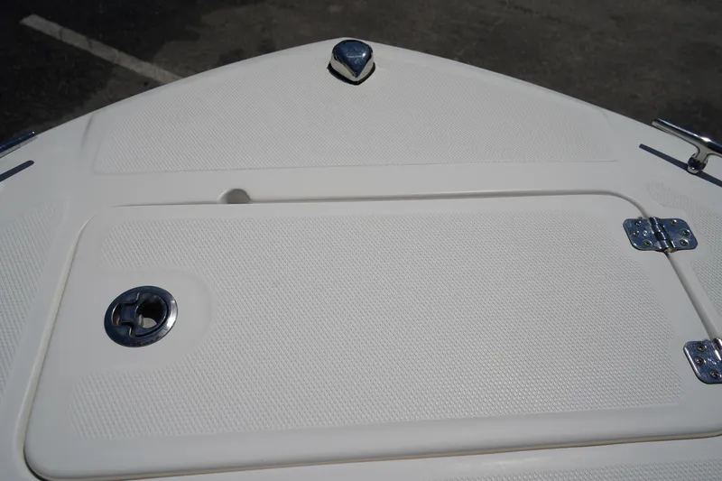 Slide: The Image of 2021 Edgewater 188CC boat deck with storage compartment and metal fixtures. - 36