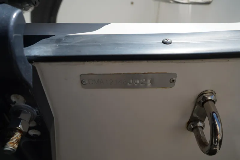 Slide: The Image of 2021 Edgewater 188CC boat detail showing hull identification number and metal fittings. - 39