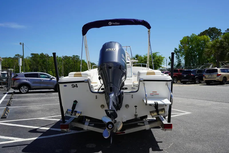 Slide: The Image of 2021 Edgewater 188CC boat with outboard motor in parking lot. - 5
