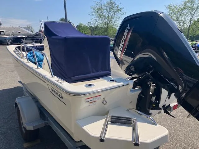 Slide: The Image of 2020 Boston Whaler 170 Montauk boat with Mercury engine on trailer. - 5