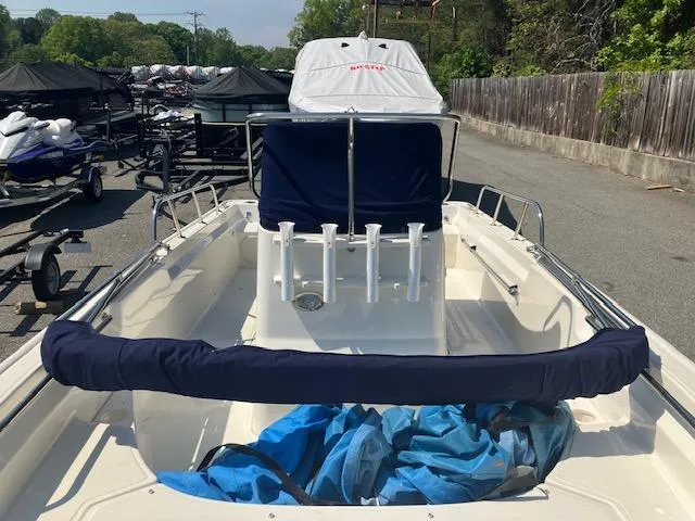 Slide: The Image of 2020 Boston Whaler 170 Montauk boat, docked with protective covers, ready for use. - 6