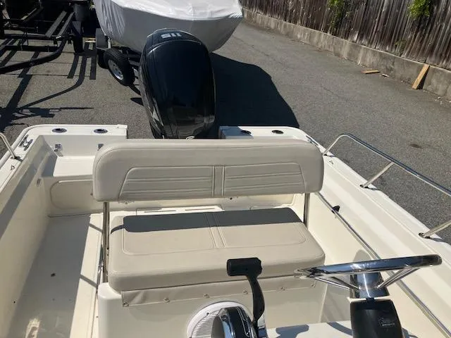 Slide: The Image of 2020 Boston Whaler 170 Montauk boat interior with steering wheel and seating. - 8