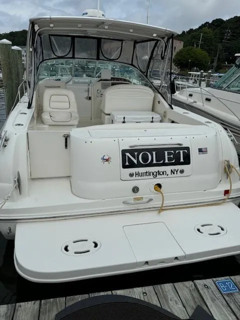 Slide: The Image of 2001 Sea Ray Amberjack boat docked, featuring spacious seating and "Nolet" nameplate, Huntington, NY. - 3