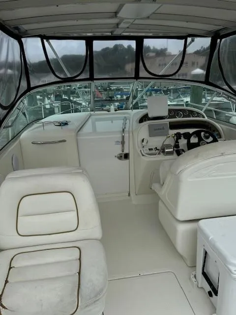 Slide: The Image of 2001 Sea Ray Amberjack boat interior with helm, seating, and navigation equipment. - 4