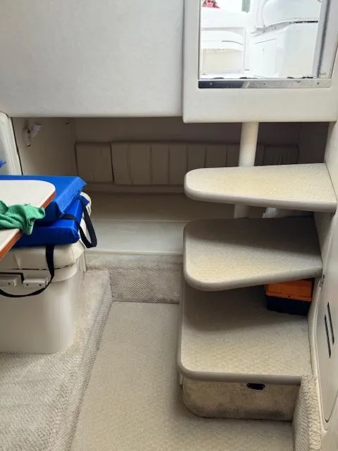 Slide: The Image of Interior of 2001 Sea Ray Amberjack boat with steps and seating area. - 9
