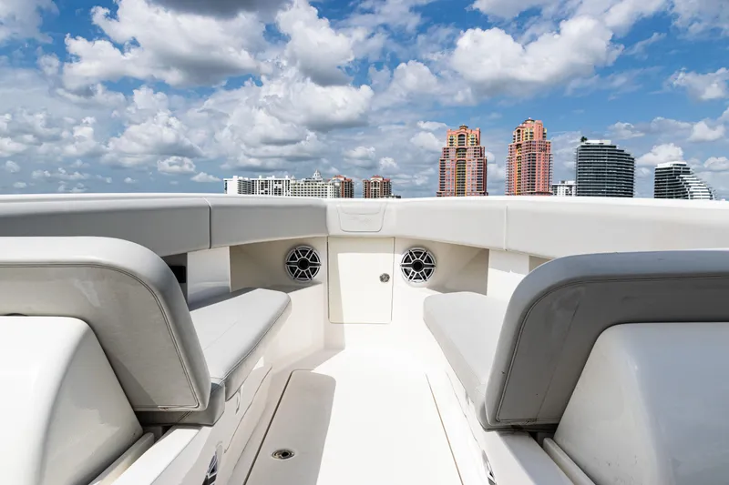 Slide: The Image of 2022 SeaVee 370z boat interior with city skyline and cloudy sky background. - 11