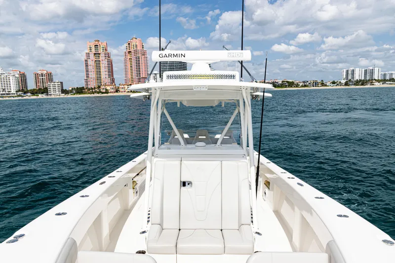 Slide: The Image of 2022 SeaVee 370z boat on water with city skyline in background. - 12