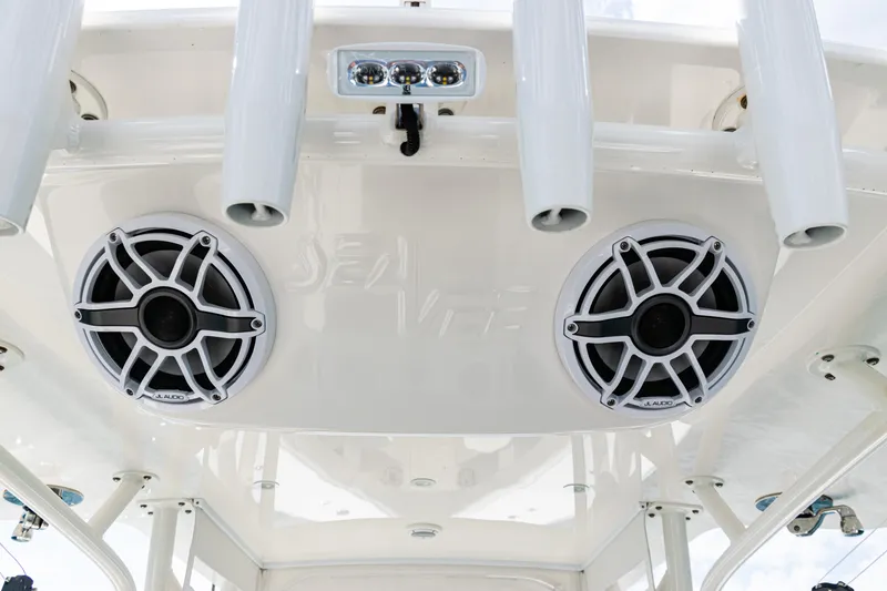 Slide: The Image of 2022 SeaVee 370z boat speakers and rod holders on the ceiling. - 14